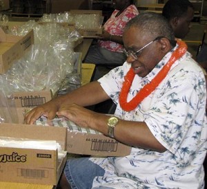 Participant unpacking boxes of juice