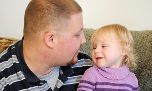 Father looking into young daughters eyes.