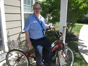 Noble participant, Ross, sitting on his bike, ready to go to work