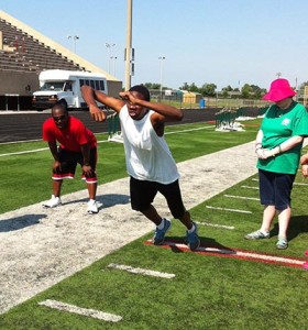 Noble participant jumping during fitness camp