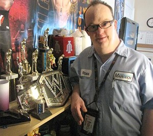 Noble participant, Ross, at home in front of a trophy shelf