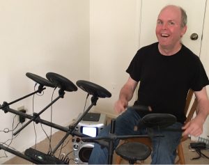 Blaine loves rocking out during Music Therapy