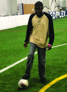 Tyrese enjoys working on his soccer skills during Rec Therapy